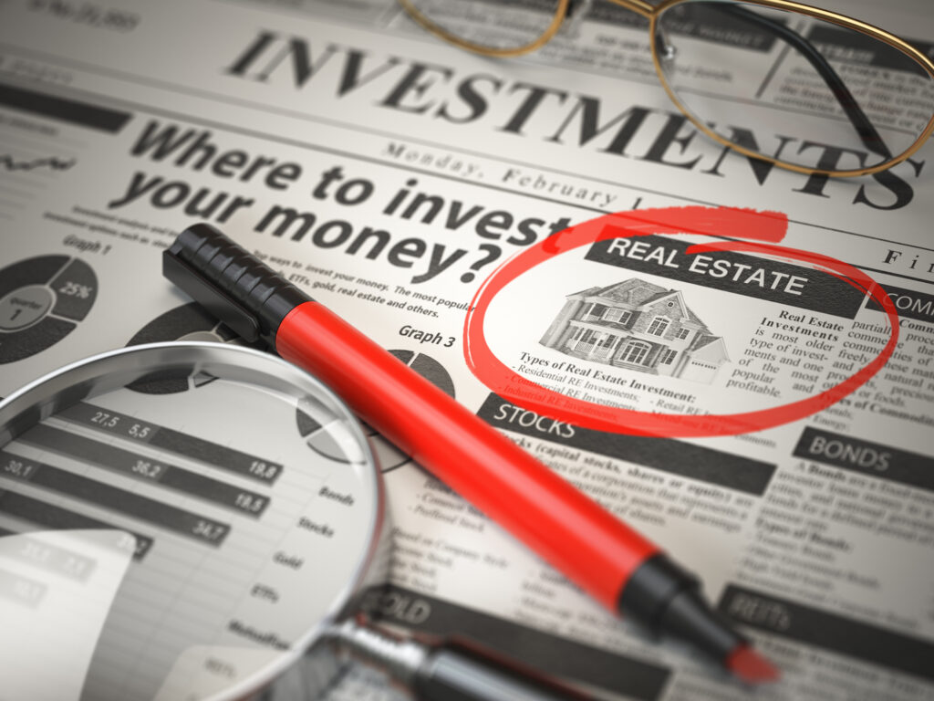 Real Estate is a best option to invest. Where to Invest concept, Investments newspaper with marker. 