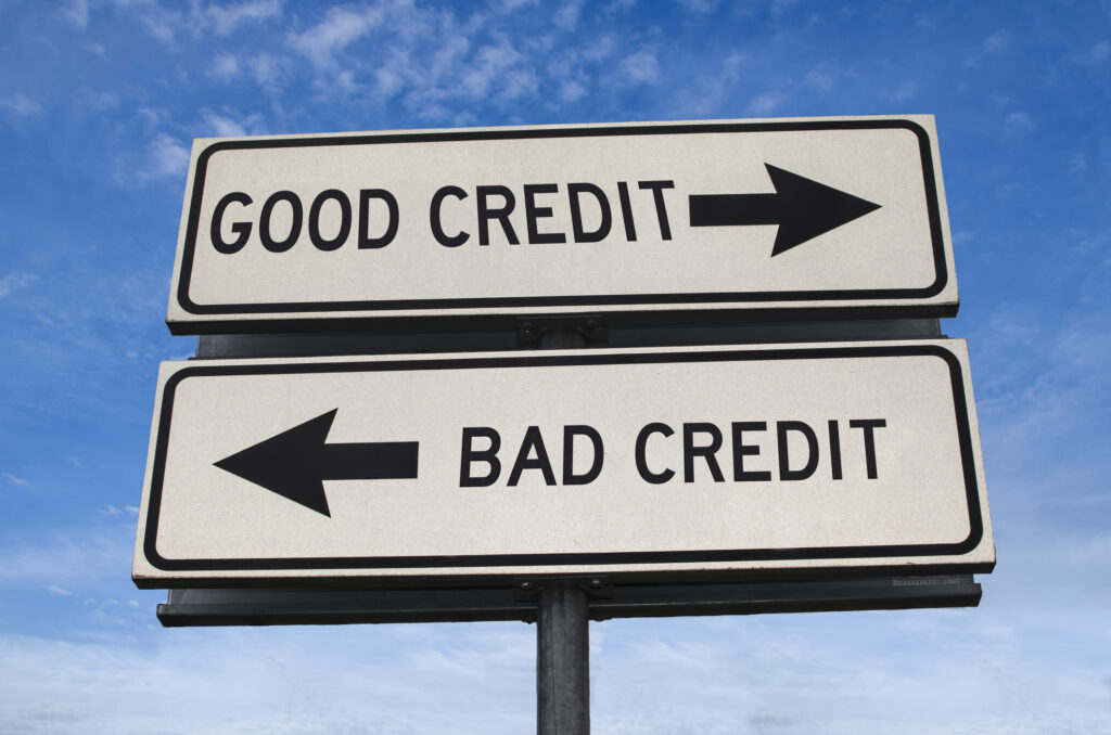 Good credit and bad credit road sign. White two street signs with arrow on metal pole with word. Directional road. Crossroads Road Sign, Two Arrow.