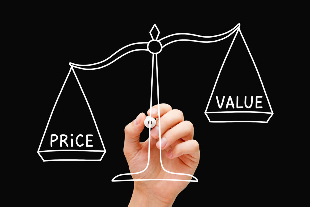 Hand drawing Price Value scale business concept with white marker isolated on black background. High price, Low value.