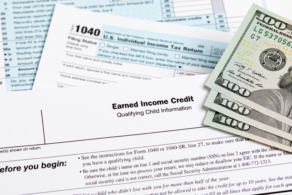 Earned Income Tax Credit (EITC) paperwork on top of 1040 tax paperwork