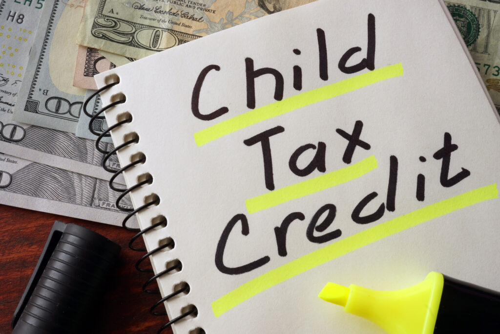 Notebook with  child tax credit sign on a table. Business concept.