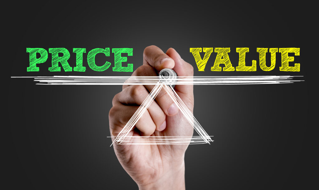 Hand writing the text: Price x Value